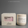 Vina Botanics candle and packaging on a gray background