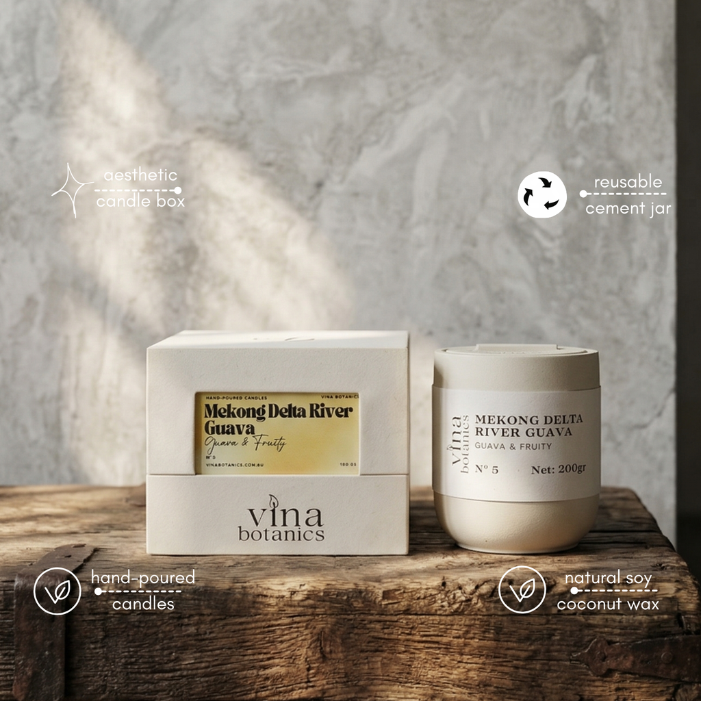 Vina Botanics candle with packaging on a wooden surface